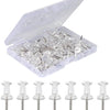 A clear plastic container filled with steel push pins and their protective plastic sleeves.