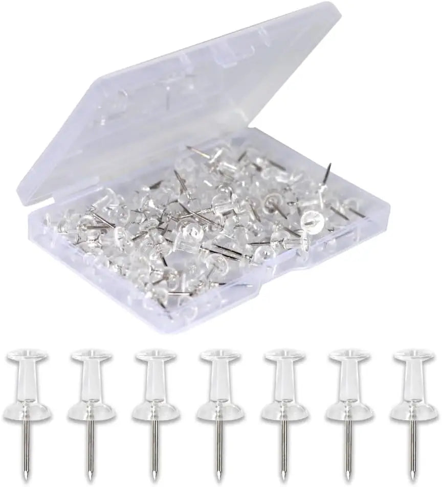 A clear plastic container filled with steel push pins and their protective plastic sleeves.