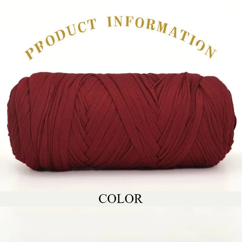 A tightly wound skein of deep maroon or burgundy thick polyester blended yarn for crafting.