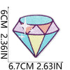 A diamond-shaped embroidery patch featuring purple and pink hues with a white star design.