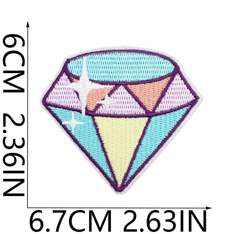 A diamond-shaped embroidery patch featuring purple and pink hues with a white star design.