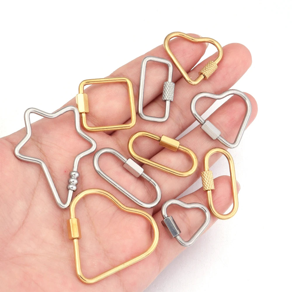 A collection of gold and silver heart-shaped screw lock carabiner clasps for jewelry making