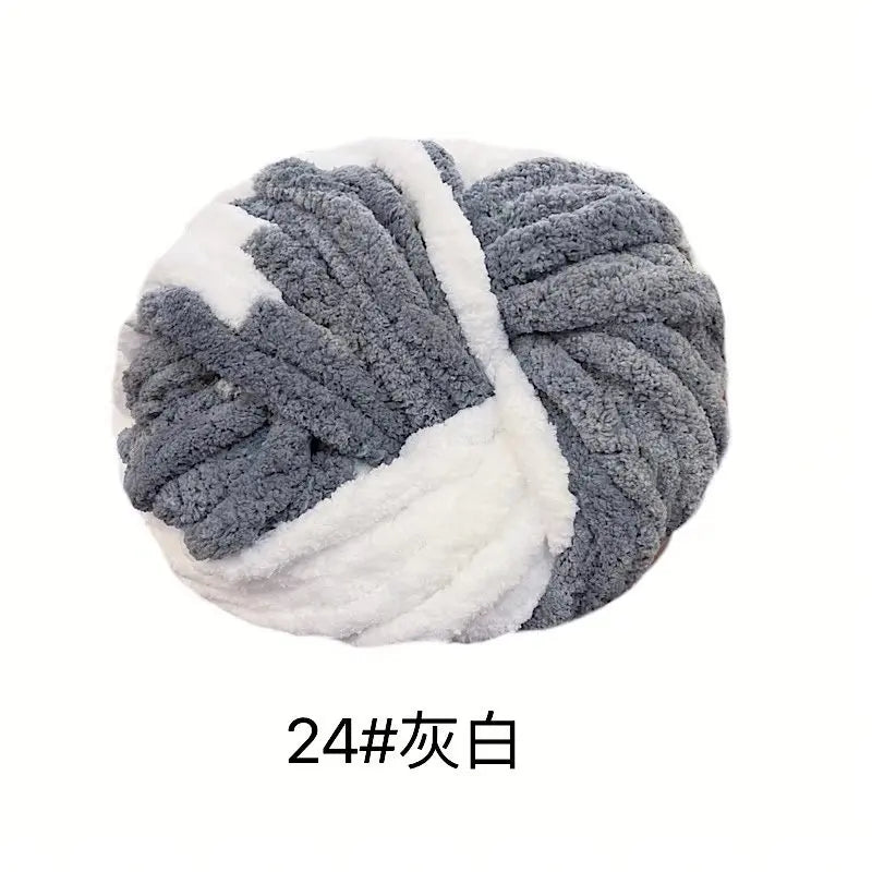 A ball of hand-woven chunky chenille yarn in gray and white stripes.