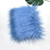 A fluffy light blue faux fur plush fabric for sewing and crafting.