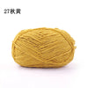 A ball of 3mm matte chenille yarn in a golden yellow color for knitting and crochet.