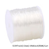 A spool of transparent elastic cord for jewelry making, measuring 1968 inches (50M).