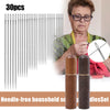 A set of 30 needle-free household sewing needles with wooden storage tubes shown next to an elderly woman.