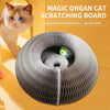 A gray, circular cat scratching board with a green ball inside, positioned next to a fluffy orange cat.