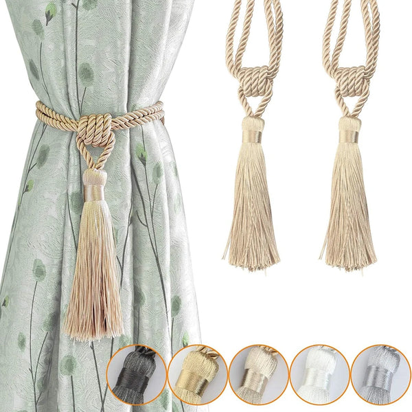 Elegant curtain tiebacks with braided rope and tassels shown against a light green fabric.