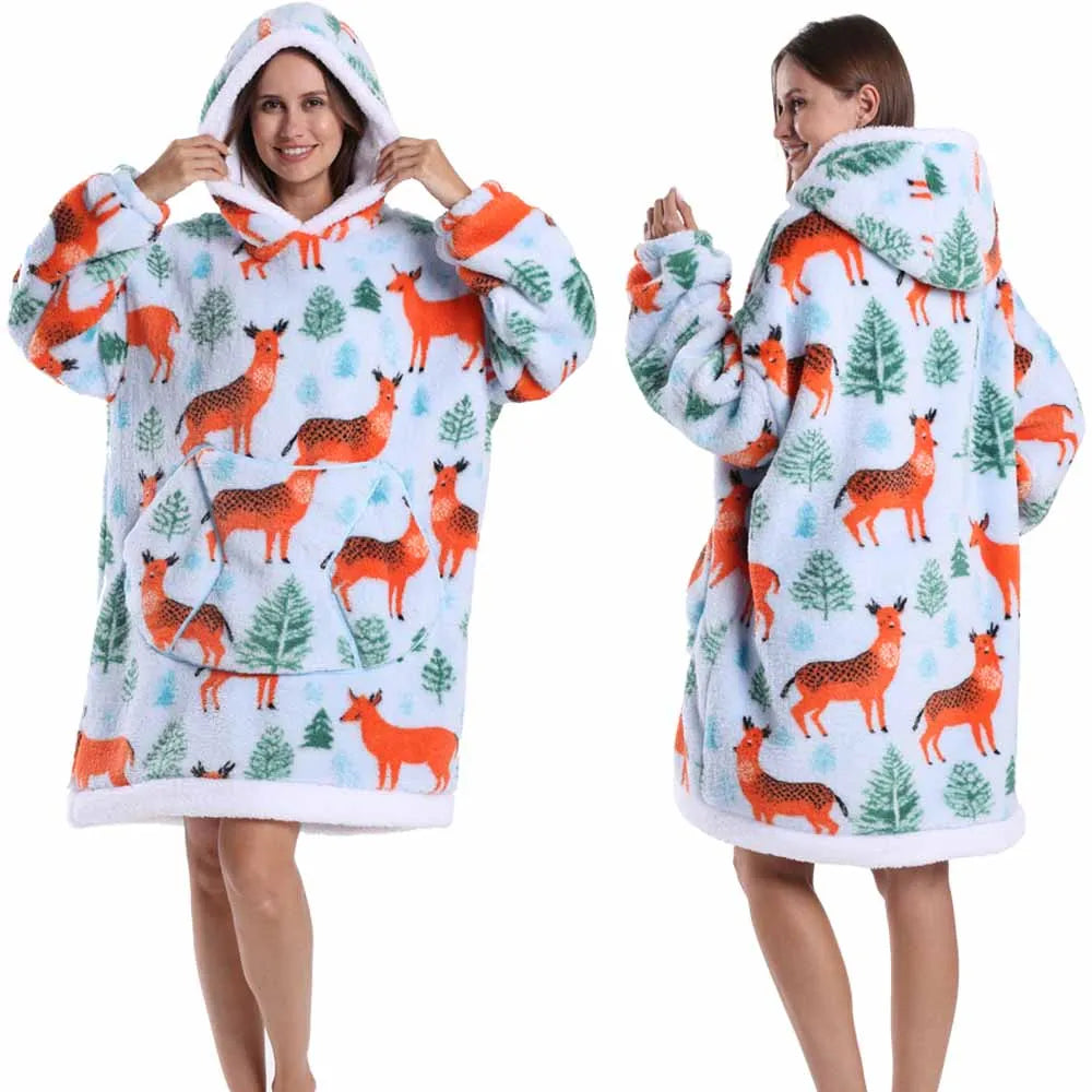 A woman models an oversized patchwork fleece hoodie in white and orange patterns.