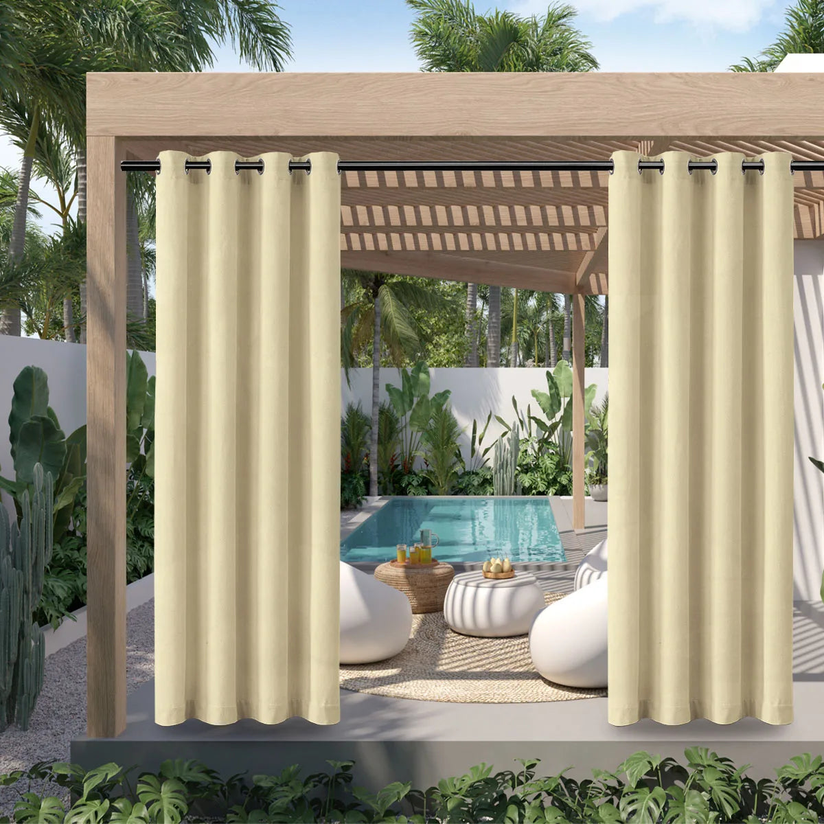 Cream outdoor curtain with grommet top hanging in a wooden pergola structure.