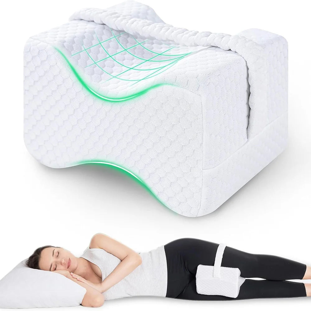 A white memory foam knee pillow with adjustable straps is shown next to a person lying down.