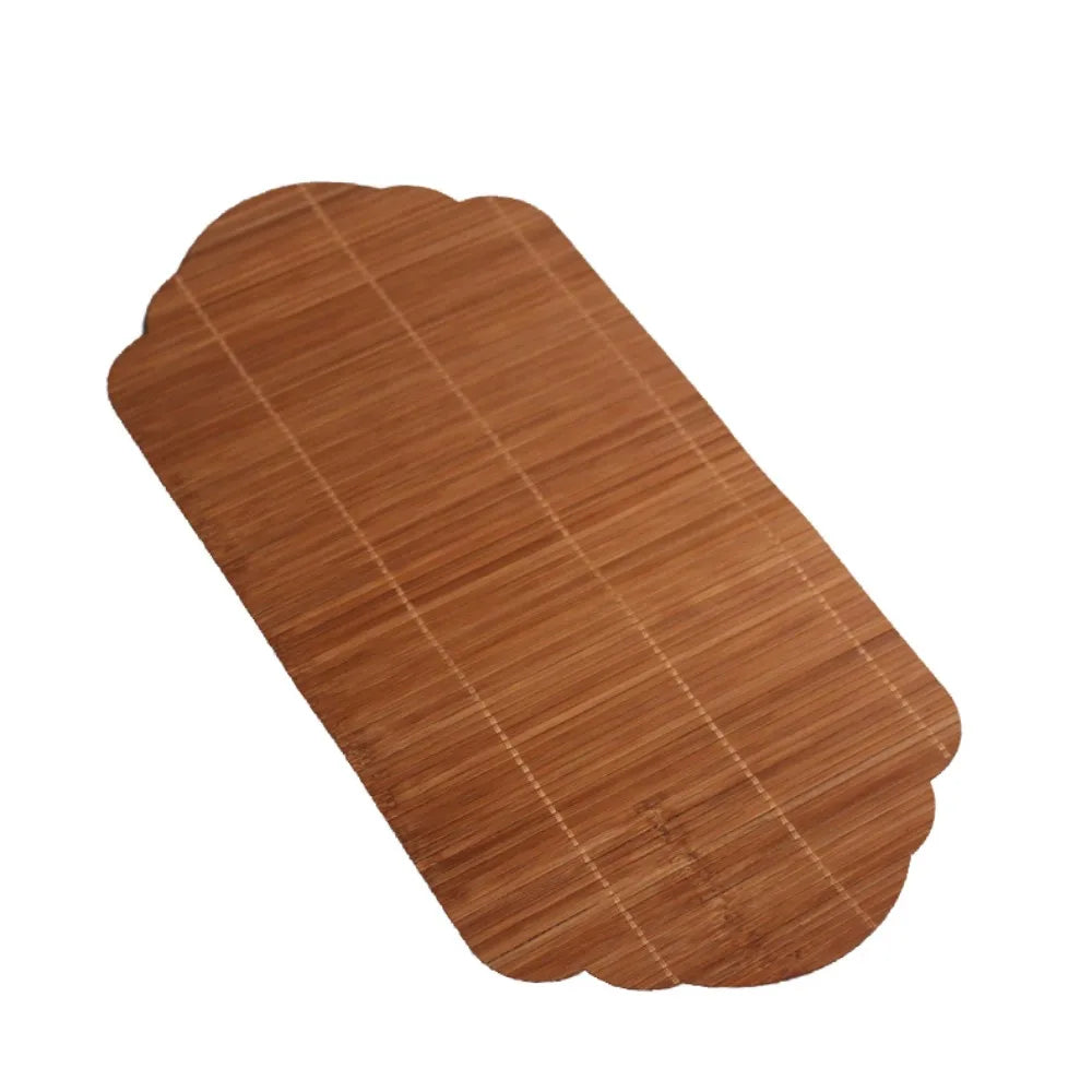 A rectangular, brown bamboo tea mat with visible woven texture and light stitching.