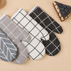 A set of heat-resistant kitchen oven gloves in gray, black, and white checkered patterns.