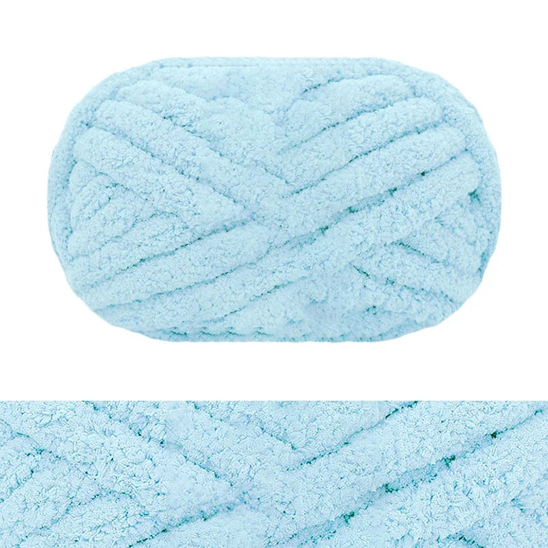 Light blue hand-knitted wool finger line scarf in a tightly twisted yarn texture