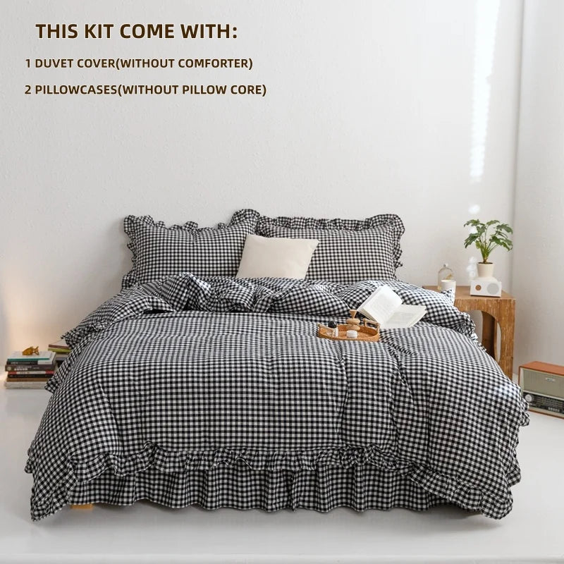 A plaid duvet cover set with a black and white checkered pattern displayed on a bed.