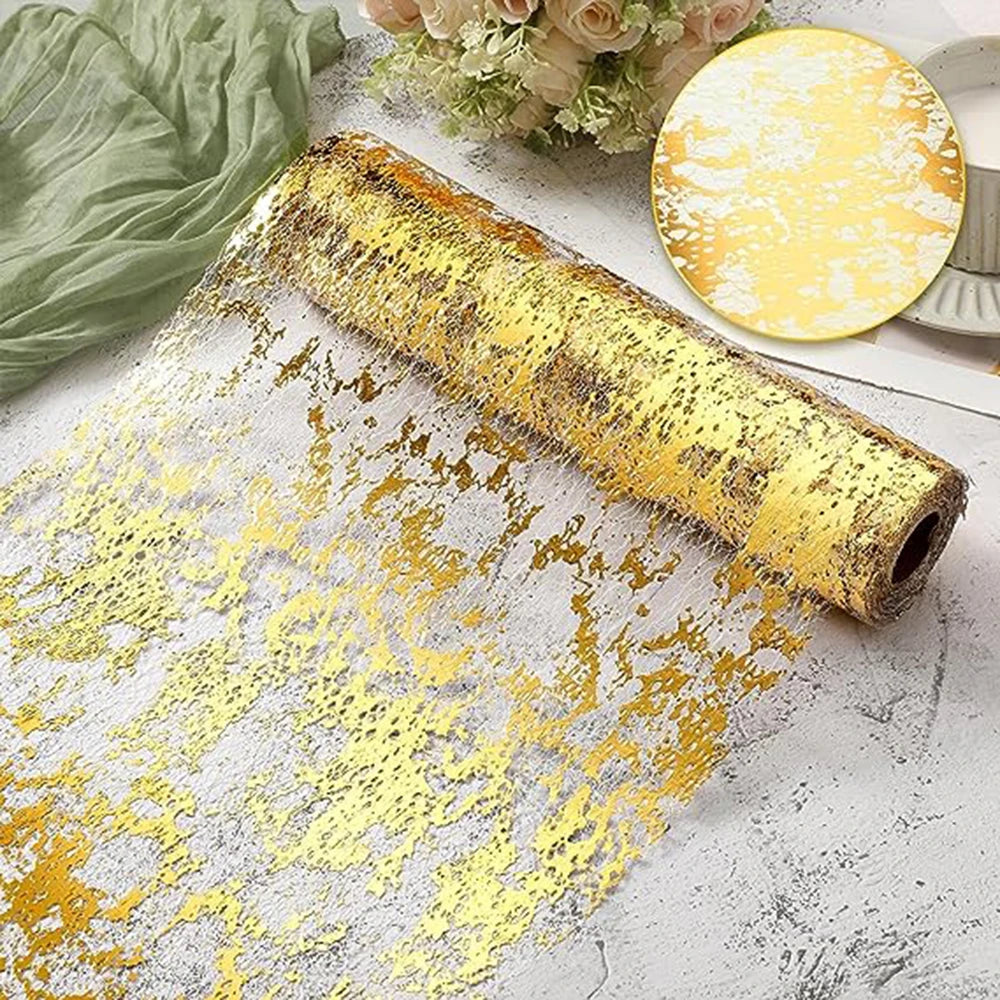 Gold sequin glitter table runner spilling onto a white surface next to a small gold plate