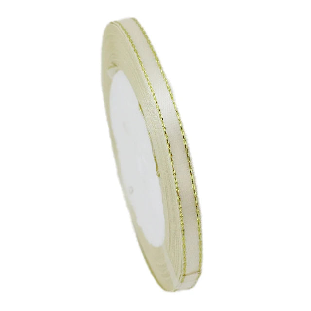 A roll of 6mm gold-edged satin ribbon for gift wrapping and crafts.