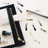 A collection of replacement metal zipper pulls in various finishes and sizes displayed on a white background.
