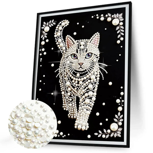 A framed painting featuring a detailed white cat covered in pearl embellishments.