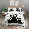 A black cat print bedding set featuring multiple cats on a white background with a quilt cover and pillowcases.