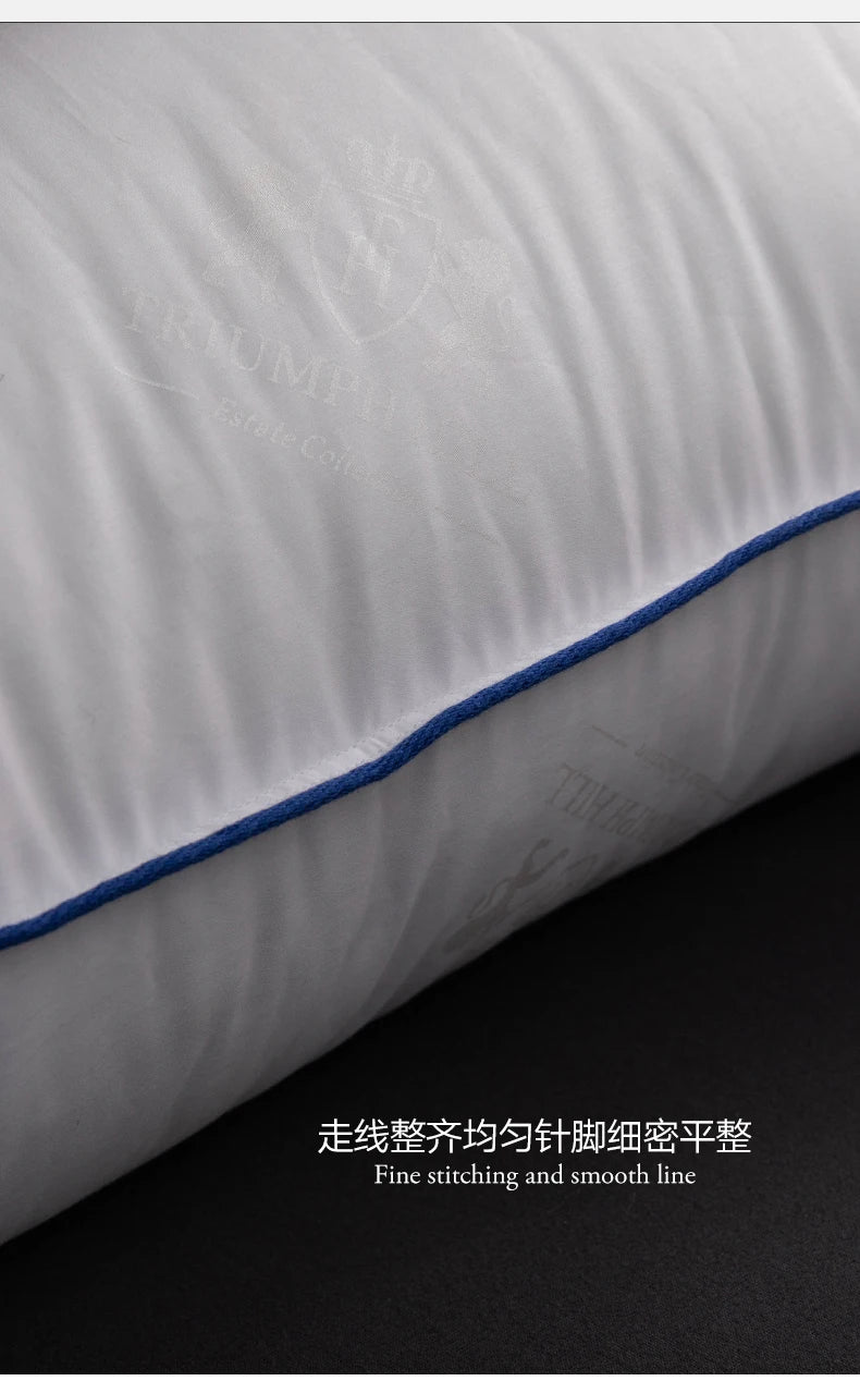 Close-up of a white pillow with fine blue stitching and smooth line.