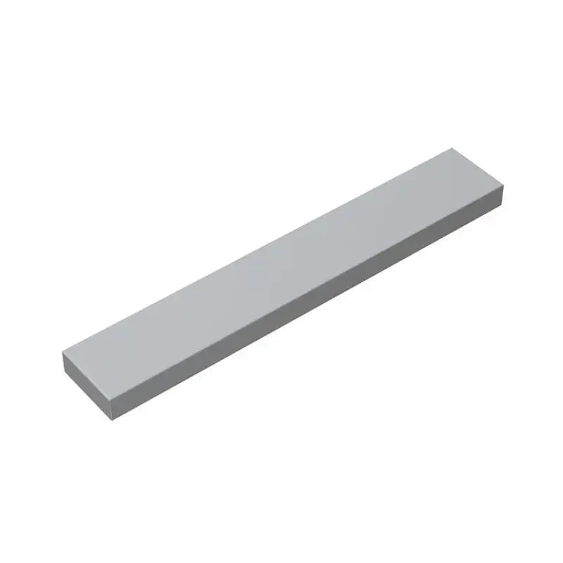 A rectangular, light gray puzzle building block kit.