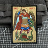 An embroidered patch depicting the Archangel Michael with a hook and loop backing.