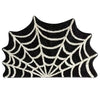 A black and cream spider web design on a door mat for Halloween