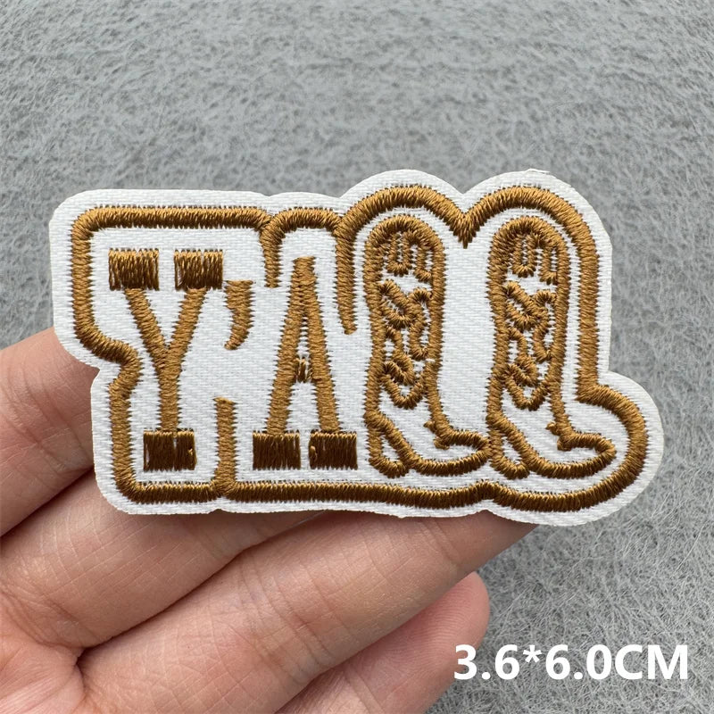 A set of Western cowboy embroidered iron-on patches featuring the letters Y A W L.