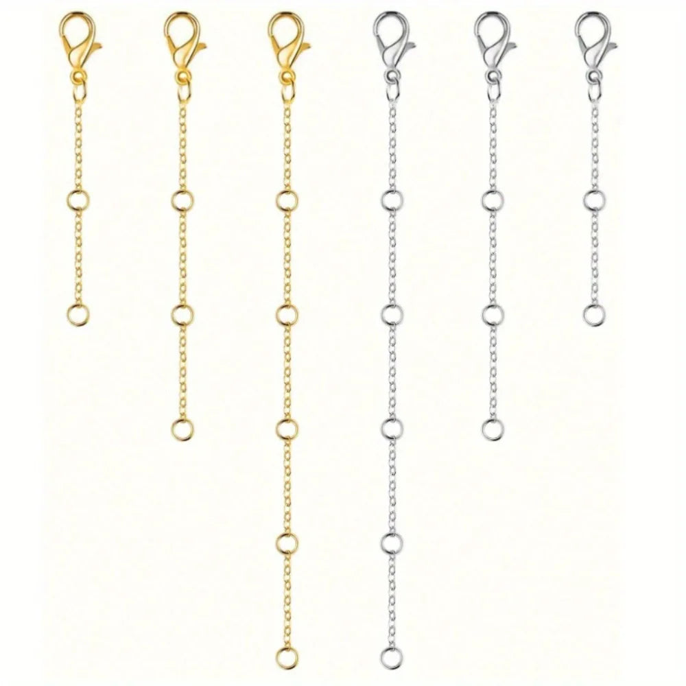 A set of gold and silver adjustable lobster clasp necklace chains displayed vertically.