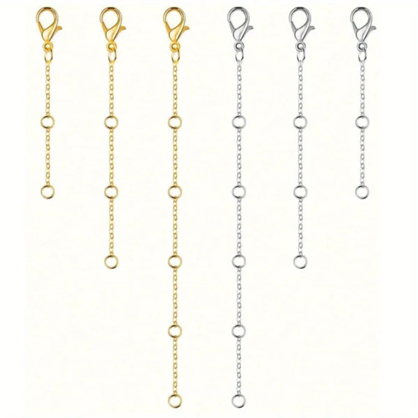 A set of gold and silver adjustable lobster clasp necklace chains displayed vertically.