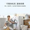 A woman is washing a garment in a white washing machine, demonstrating the easy cleaning method for bamboo pillow protectors.