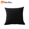 A dark gray or black linen cushion cover with a button closure.