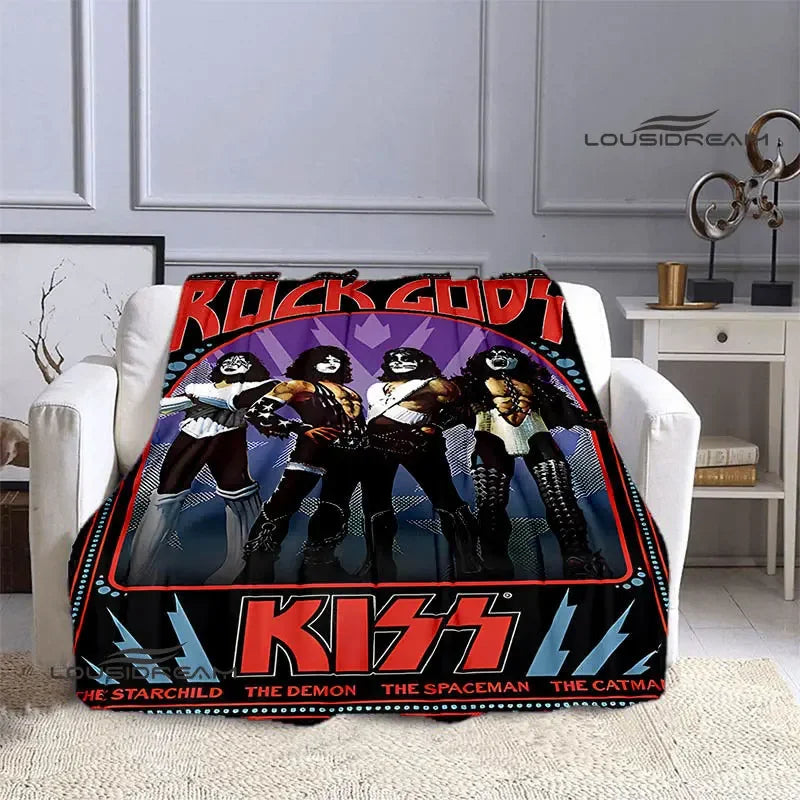 A black and red printed flannel travel blanket featuring a rock band design with various characters.