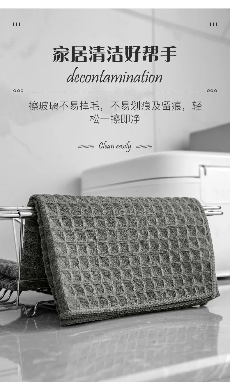 A dark gray, textured microfiber cleaning towel is displayed on a rack, intended for decontamination.