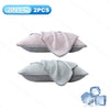 Two pink and light gray ice silk cooling pillowcases shown next to a piece of ice.