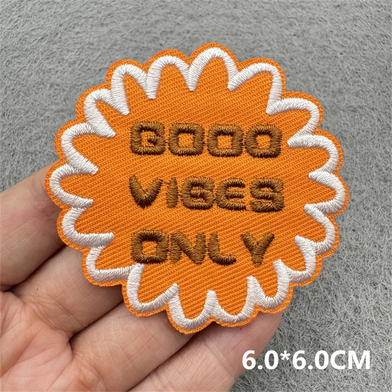 Orange embroidered patch with white border featuring the text GOOD VIBES ONLY
