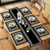 A set of minimalist geometric table runner placemats with gold accents and silver bowls on a wooden table.