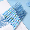 A set of blue ergonomic crochet hooks with floral patterns arranged on a white background.
