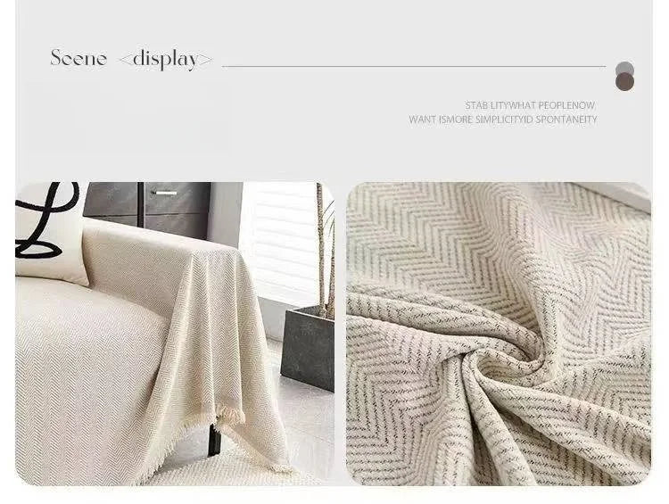 A close-up of a beige minimalist herringbone chenille sofa cover draped on a light-colored sofa.