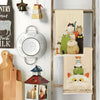 A set of two cat-themed kitchen towels featuring various cats in watercolor style hanging on a wooden rack.