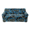 A modern sofa covered in a black and blue geometric pattern with a stretchable fabric.