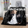 A black graphic throw blanket featuring a portrait of a man in a leather jacket and white shirt.
