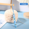 A blue ergonomic crochet hook with a 3.5mm needle is shown next to a ball of light pink yarn.
