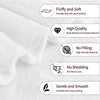 A close-up of a white knitted throw blanket showing features like fluffiness, high quality stitching, and durability.
