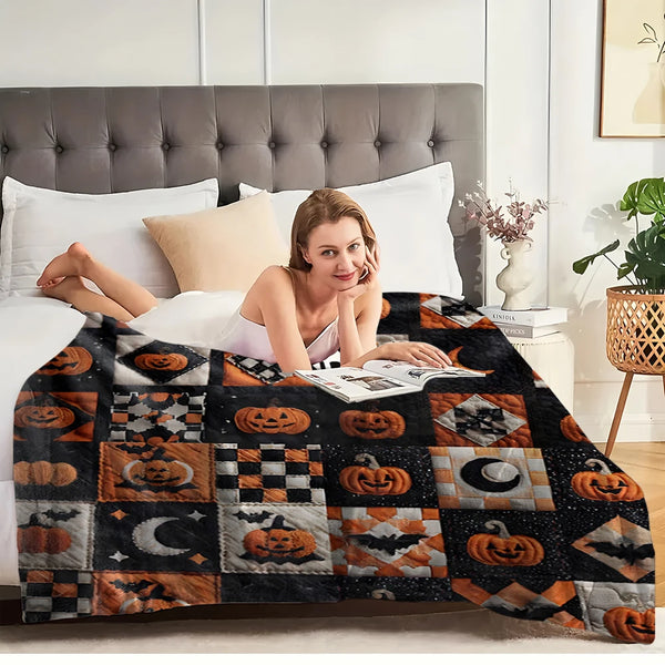 A woman relaxing on a bed with a vintage patchwork flannel throw blanket featuring Halloween-themed patterns.
