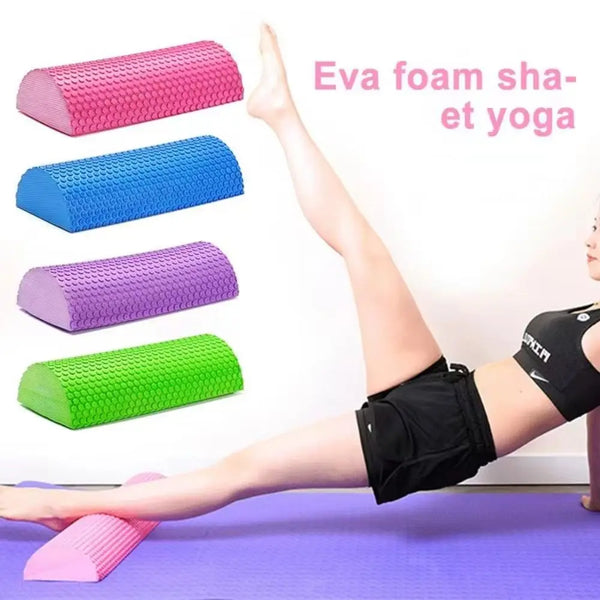 A collection of pink, blue, purple, and green EVA foam massage rollers used for yoga and fitness exercises.