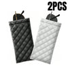 Two quilted PU leather eyeglass cases in black and white with cleaning cloths