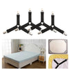 Adjustable sheet corner grippers with elastic straps shown above and in context on a bed frame.